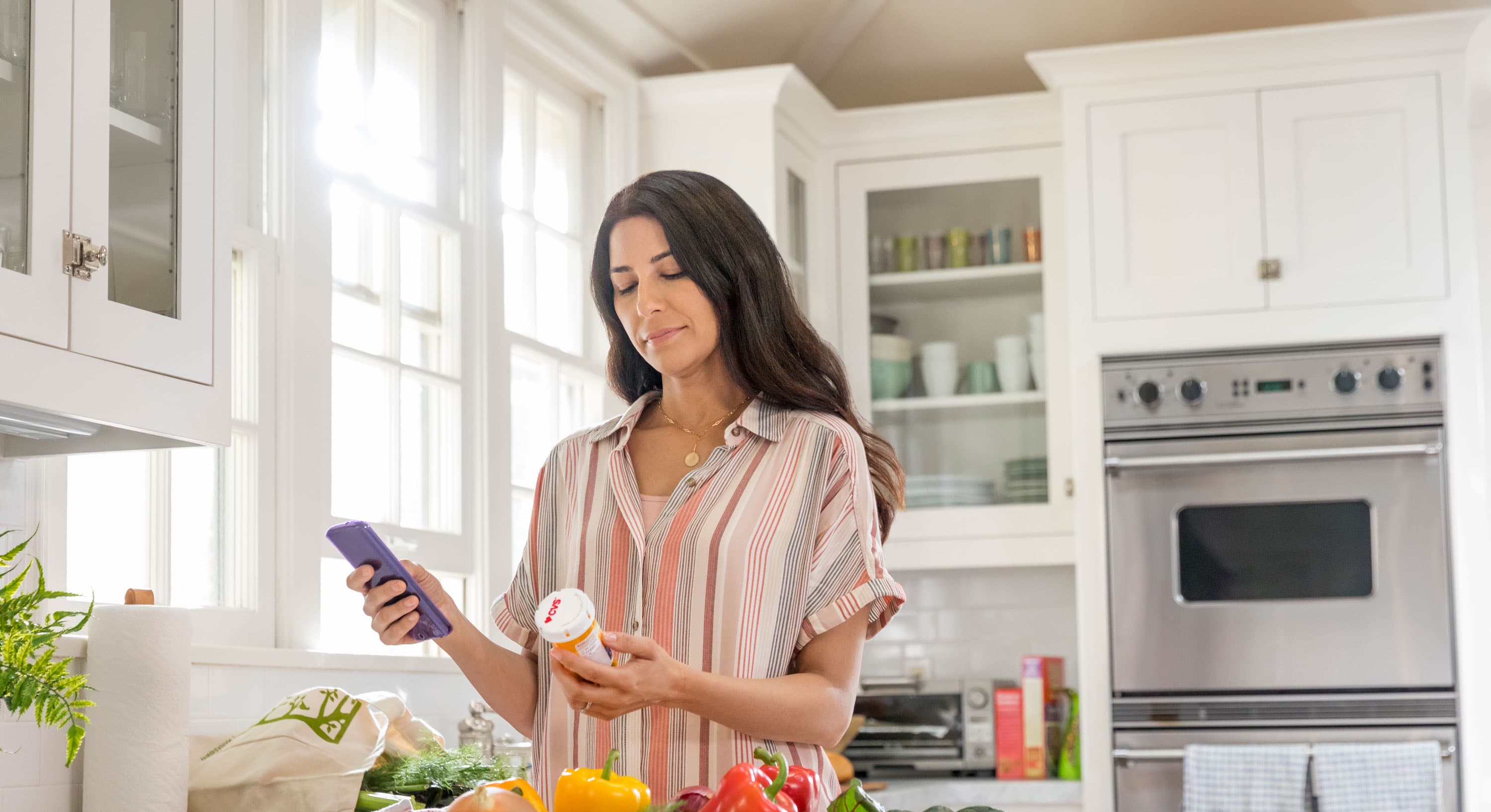 Woman with prescription bottle