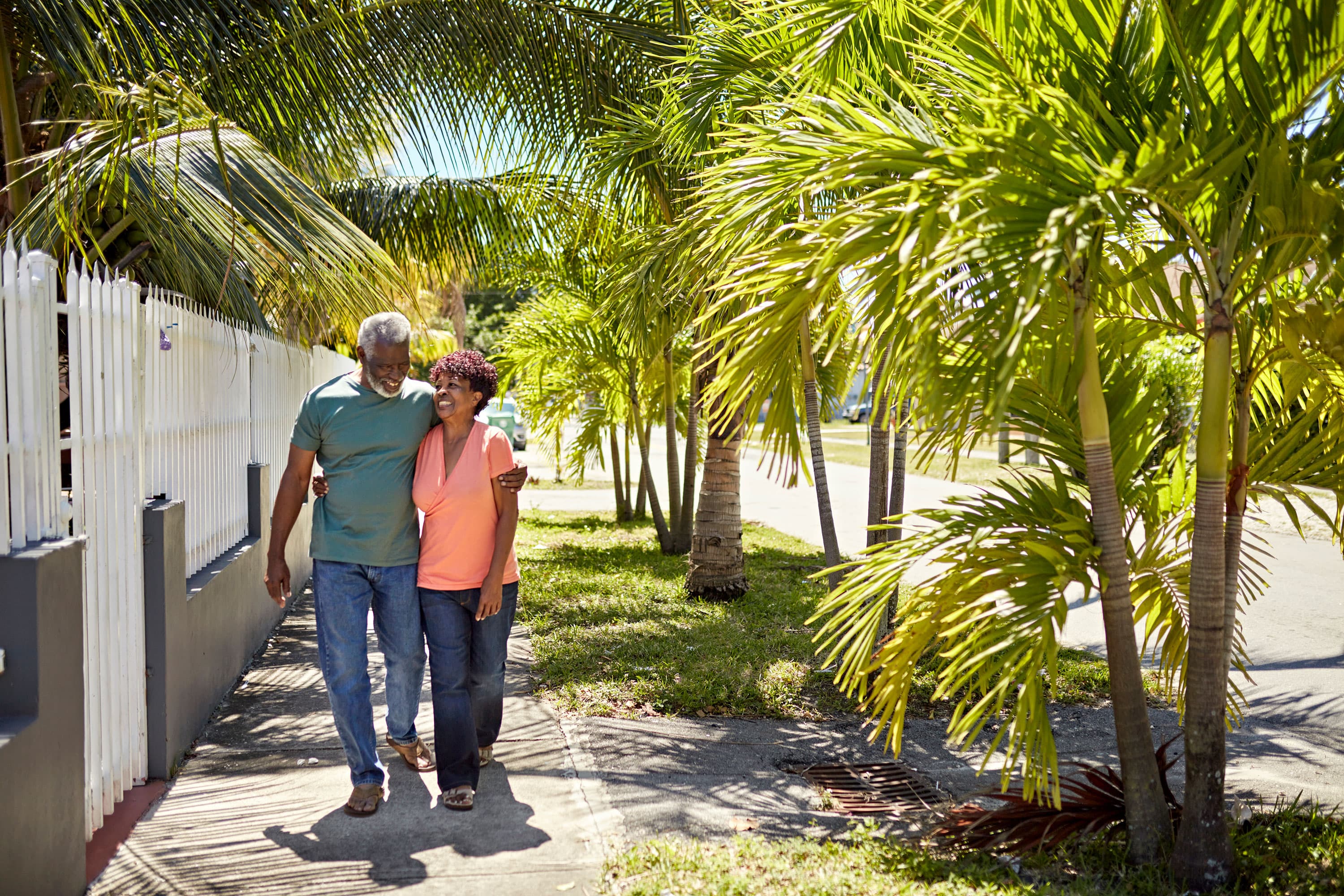 A couple walking on the sidewalk in Miami